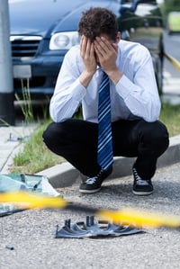 Elegant man crying at accident scene, vertical